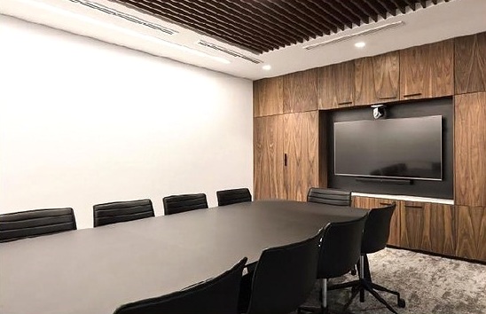 Meeting room with timber wall and display screen