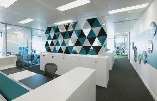Office reception with geometric feature wall